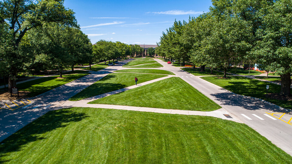 Student walking on East Campus.